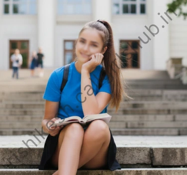 Reshma, College call girl in rishikesh wearing blue t-shirt and skirt and sitting on stairs in rishikesh College